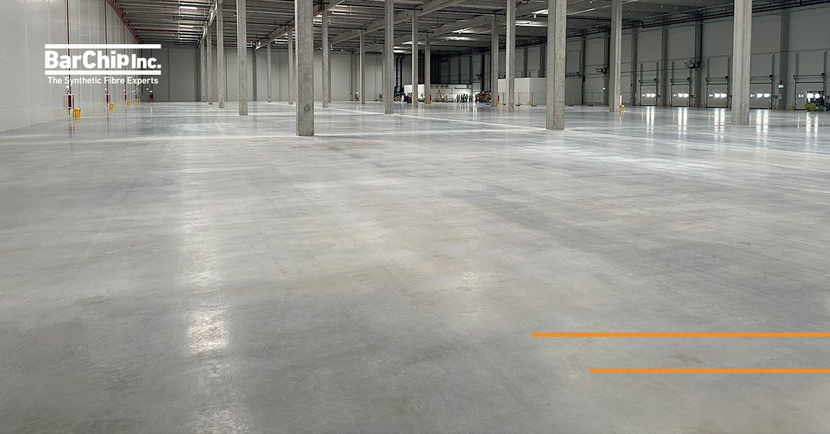 Fibre reinforced jointless concrete floor at the Hello Parks distribution centre featuring 24 m × 24 m joint spacing and a fibre-free surface finish.