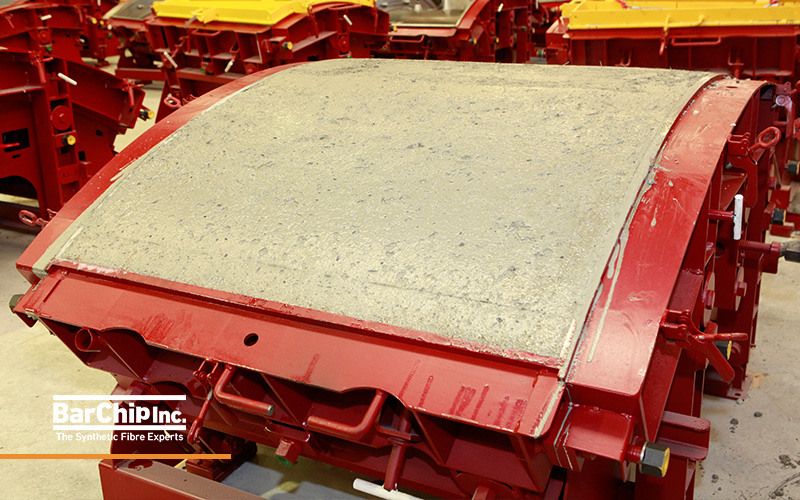 Fibre reinforced precast tunnel segment cast in steel a mould.