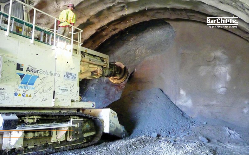 Roadheader excavating a tunnel using NATM construction.