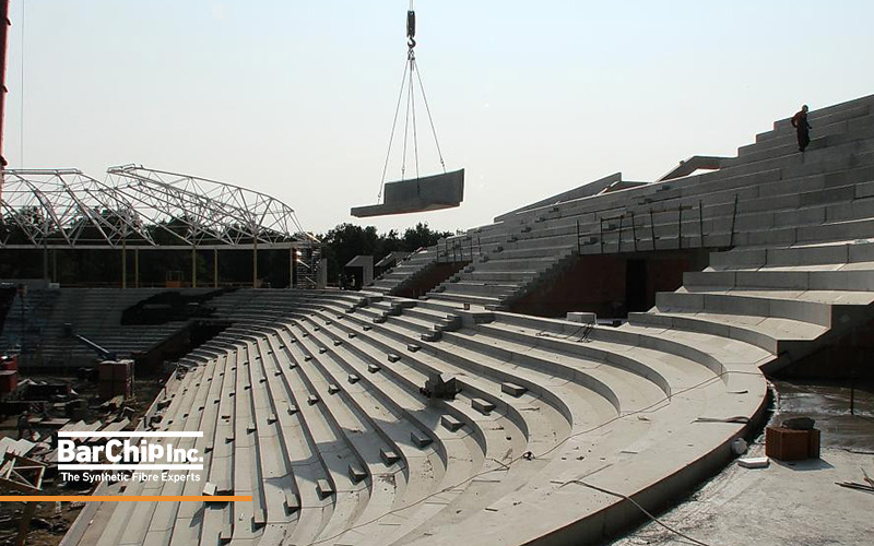 Curved prestressed precast grandstand seating under construction at Debrecen Stadium.