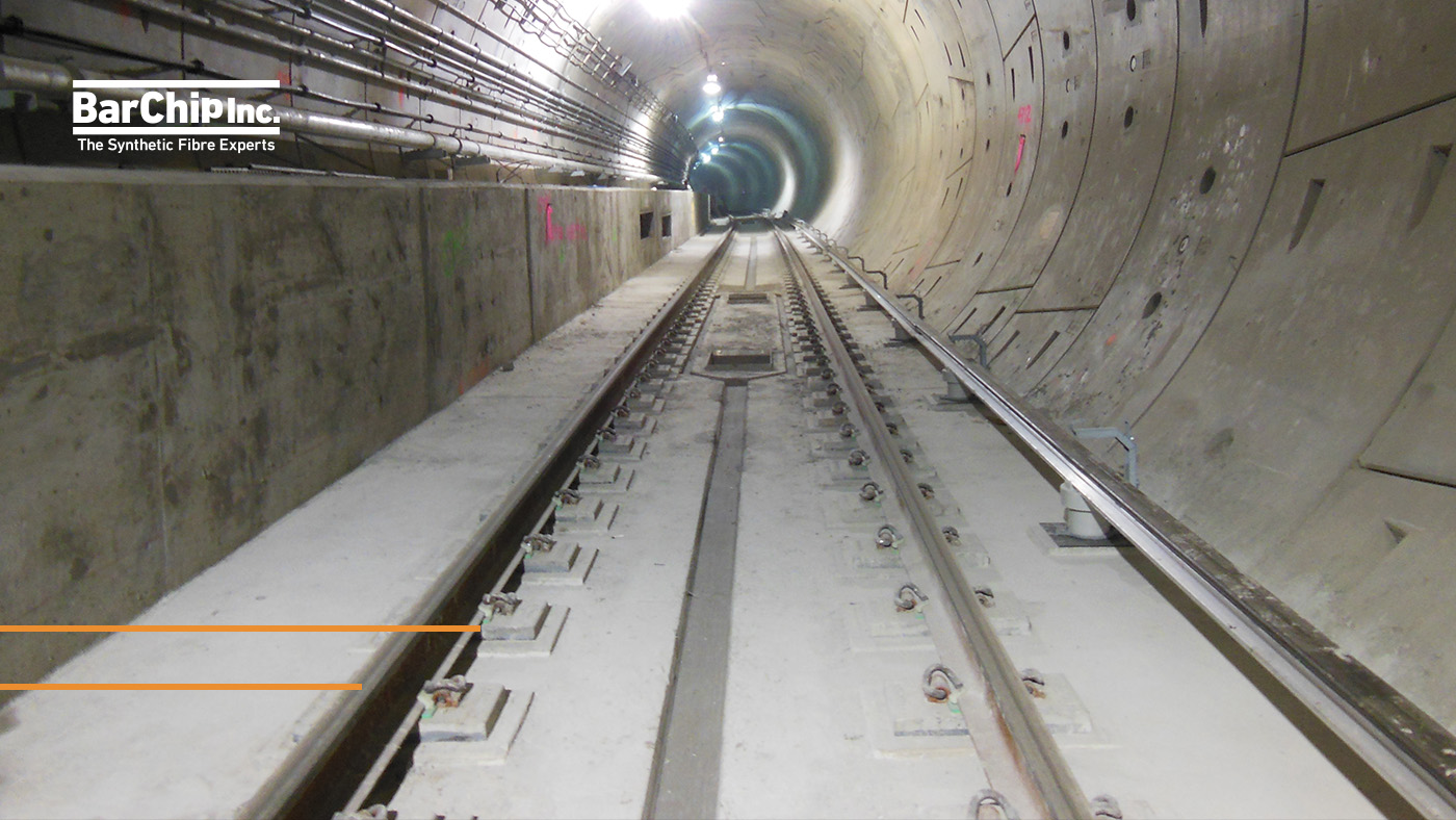 Fibre reinforced metro trackslab showing rail tracks encapsulated in the trackslab. Seen here at the East Side Access in New York City, it was the first use of fibre reinforced track slab in North America.