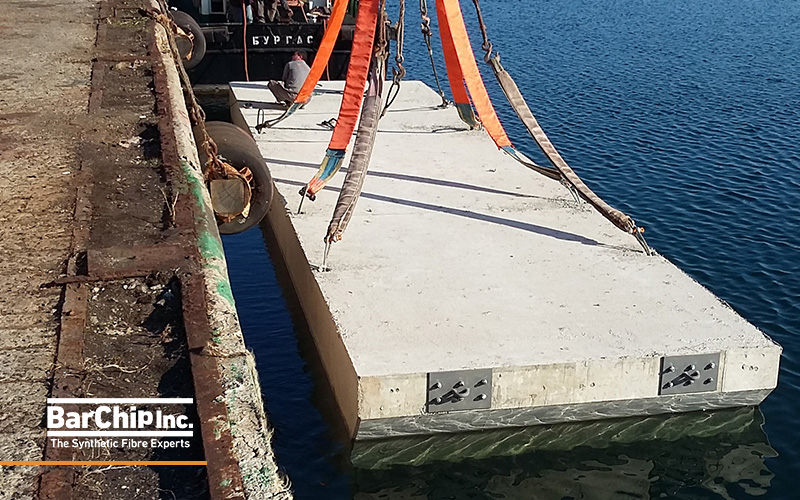 Fibre reinforced precast concrete pontoon floating being installed at Port Chernomorets marina.
