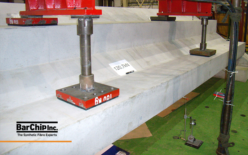 Full-scale structural testing of prestressed precast grandstand element reinforced with BarChip macro synthetic fibres.
