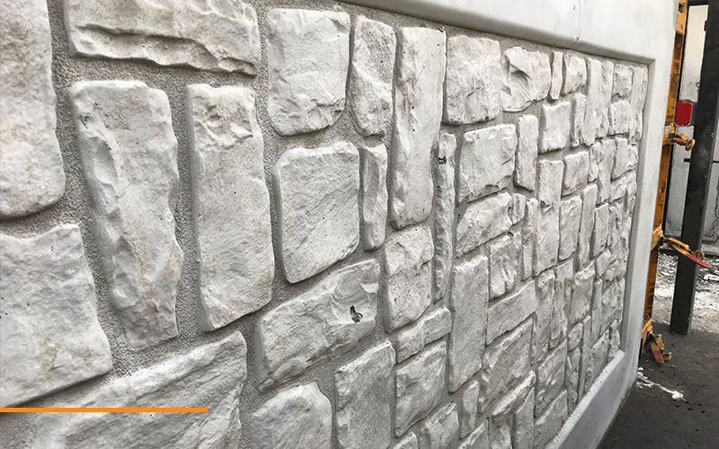 Close-up of architectural precast concrete stone texture.