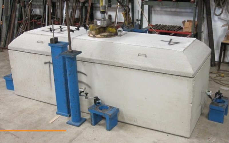 Static load testing of fibre reinforced precast burial vault.