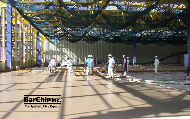Construction workers placing fibre reinforced concrete for the Toyota Miyata Plant industrial floor.