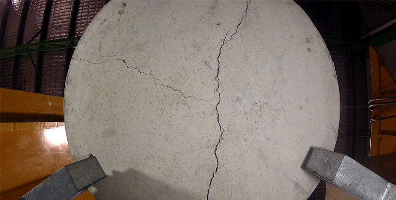 ASTM C1550 round panel showing radial cracking after testing